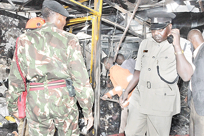 Police and fire fighters inspect the scene of an explosion at a building housing business stalls in Moi Avenue at the centre of Nairobi, capital of Kenya. Net  photo.