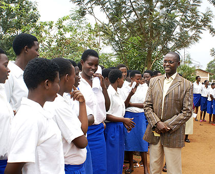 Minister Mathias Harebamungu with students. The New Times / File.