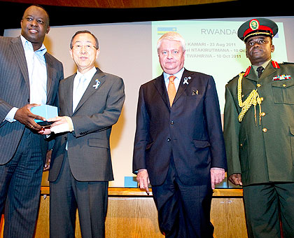 L-R: Ambassador Eugene-Richard Gasana, Ban Ki-moon, Under-Secretary-General of Peacekeeping Operations, Hervu00e9 Ladsous, and Col. Vincent Nyakarundi at the UN headquarters in New York. The New Times/ Courtesy.