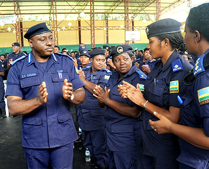 IGP Emmanuel Gasana joins female police officers in morale-boosting session at the second annual female police convention in Kigali yesterday. The New Times / John Mbanda.