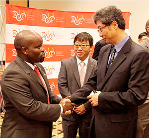 Minister of Youth & ICT Jean Philbert Nsengimana chatting with Heon Lee charge du2019Affaires of the Korean Embassy in Rwanda. The New Times / T Kisambira