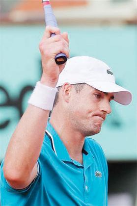 John Isner reacts to his second round loss.  Net photo.