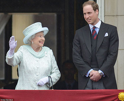 The Queen looks up in awe at Prince William during the flypast outside of Buckingham Palace