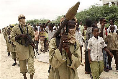 A member of the hardline Al Shabaab Islamist rebel group carries a rocket propelled grenade (RPG) during a demonstration in Mogadishu, October 30, 2009. Net photo.