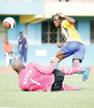 Meddie Kagere unsuccessfully tries to lob Benin keeper Fabien Farnolle in the first half. He and his striking partners wasted a few good scoring chances, which cost Amavubi victory. The New Times/T. Kisambira.