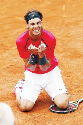 Spainu2019s Rafael Nadal celebrates after winning against Serbiau2019s Novak Djokovic their Menu2019s Singles final on Monday. Net photo.