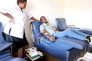 A man donating blood. The New Times / T. Kisambira.