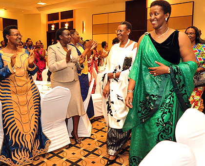 First Lady Jeannette Kagame(R) with her Ugandan counterpart Janet Museveni arrive at Serena Hotel for the Prayer Breakfast yesterday. The New Times / Timothy Kisambira.