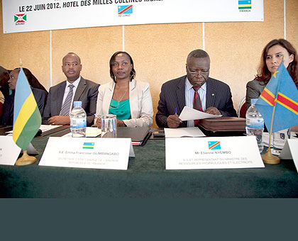 L-R, Minister of Infrastructure Albert Nsengiyumva, Emma Francoise Isumbingabo, the State Minister for Water and Energy and delegate from DR Congo, Etienne Nyembo at the meeting in Kigali yesterday. The New Times / Robyn Specta.