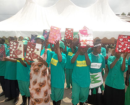 Miners hoist their rewards during celebrations to mark their day earlier this year. The New Times / File.