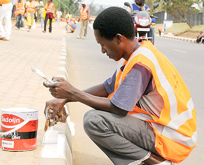 Kigali pavements are getting a retouch as preparations for the countryu2019s Independence Golden Jubilee and 18 years of Liberation celebrations continue. The anniversaries will be jointly marked on Sunday, July 1.   The New Times / Timothy Kisambira.