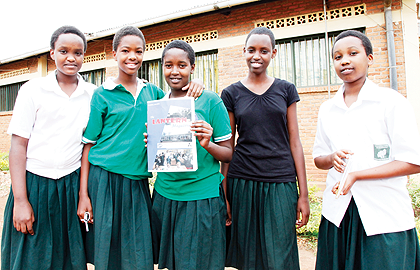 Some of the members of Lantern Group displaying their magazine. The New Times / T. Kisambira.