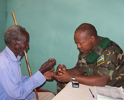 An RDF doctor attends to a patient at Gihundwe hospital on Monday. An estimated 7,000 people are set to benefit from the service. The New Times / JP Bucyensenge.