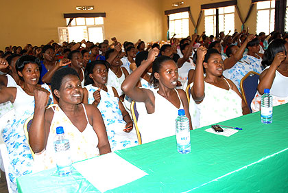 Women applaud during the CNF conference in Rwamagana.  The New Times / S. Rwembeho.