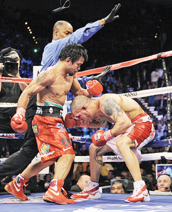 A rematch with Miguel Cotto (R) is one possibility for Manny Pacquiao on Nov. 10. Net photo.