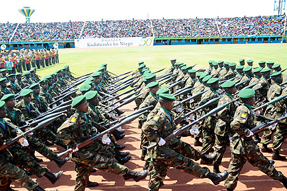 Troops march past the VIP pavillion yesterday. The New Times / J. Mbanda.