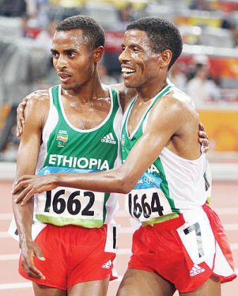 Kenenisa Bekele (gold medal) of Ethiopia is congratulated by teammate Haile in Beijing Olympics. Net photo.