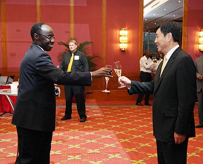 Rwandau2019s Ambassador to China, Francois Xavier Ngarambe, welcoming Zhai Jun, Chinese Vice-Minister of Foreign Affairs.The Sunday Times / Courtesy.