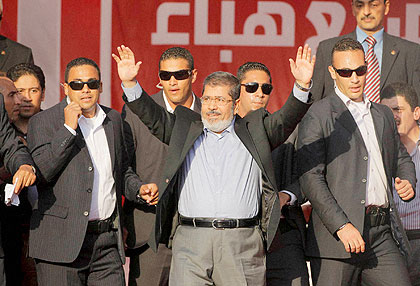 The new Egyptian leader Mohammed Mursi waves to supporter after he was declared winner last month, Net Photo.