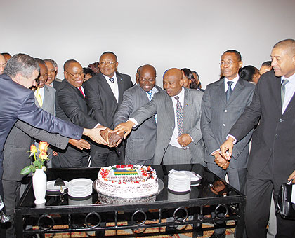 Amb Prof. Joseph Nsengimana (Centre with knife) cuts the cake in Ethiopia.  See story on page 2. The New Times / Courtesy.