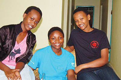 (L - R ) Devin Mutoni, Chantal Mahoro and Elisabeth Mukayuhi, the winners of the South Africa scholarship. The New Times / Susan Babijja.