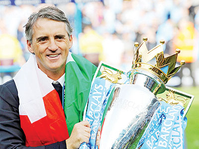 Roberto Mancini enjoys his moment after leading Manchester City to their first English league title in 47 years. Net photo.