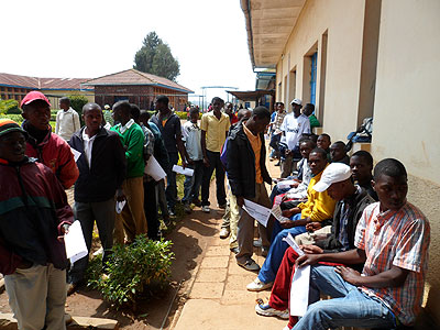 Youth line up for circumcision. The New Times / File.