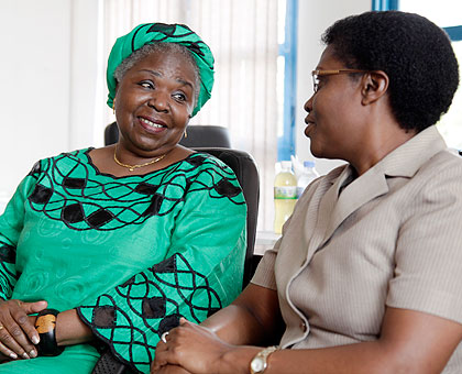 Malawian Ombundsman Justice Tujilane Chizumila (L) chats with the deputy Ombundsman of Rwanda Bernadette Kanzayire on arrival. The New Times / File.