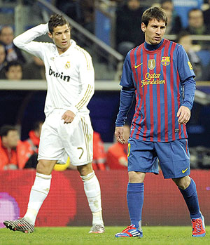 Cristiano Ronaldo and Lionel Messi during a past Spanish Cup clasico. Net photo.