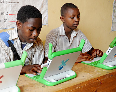 Pupils concentrate on their laptops.   The New Times /  John Mbanda.