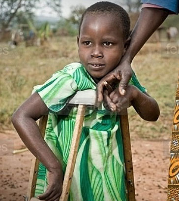 A disabled child being helped by her mother. Net photo.