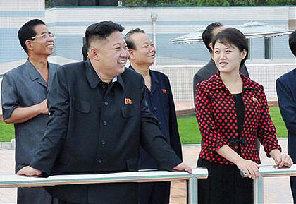 North Korean leader Kim Jong-Un (2nd L) and  an unidentified woman. Net photo