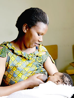 A mother breast feeding her baby. The New Times / File.