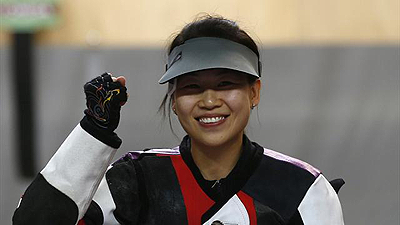 China's Yi Siling smiles after winning the women's 10m air rifle final competition at the London 2012 Olympic Games in the Royal Artillery Barracks.