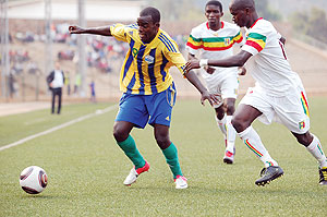 Bon Fils Kabanda beats off Diallo Boubacaru2019s challenge in yesterdayu2019s Africa Youth Championship qualifier played at Stade de Kigali. Rwanda won 2-1.  Photo / E. Niyonshuti.