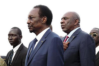 Maliu2019s interim President Dioncounda Traore (C) arrives at the main airport in the capital Bamako. Net photo.