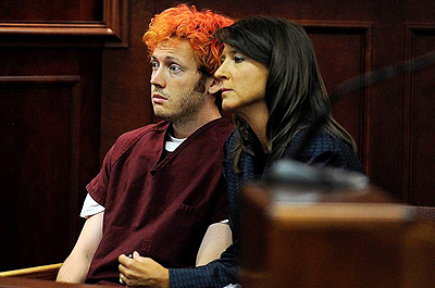 James Holmes (L) was arrested in the cinemau2019s parking lot minutes after the attack in Aurora, Colorado. Net photo.