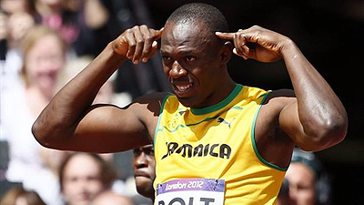 Jamaicau2019s Usain Bolt gestures before competing in his menu2019s 100m round 1 heat. Net photo.