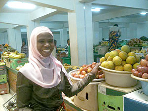 Justine Mukangabo, a vendor at the market, at her stall