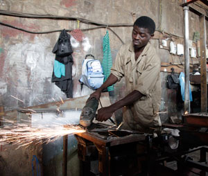 Sam Ndizeye making a wind stove. The New Times / T. Kisambira.