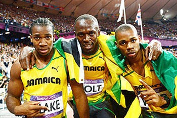 Yohan Blake, Usain Bolt and Warren Weir celebrate their phenomenal 1-2-3 for Jamaica. Net photo