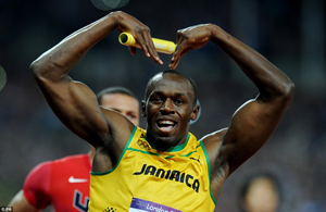 Usain Bolt celebrates winning the Men's 4x100m Relay and his third gold medal. Net photo