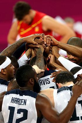 The United States players join hands as they celebrate winning the Men's Basketball gold medal. Net photo.