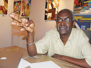 Rwandan artist Epa Binamungu, wearing a cream short sleeved casual shirt, speaks during an interview at his studio in Kacyiru. 