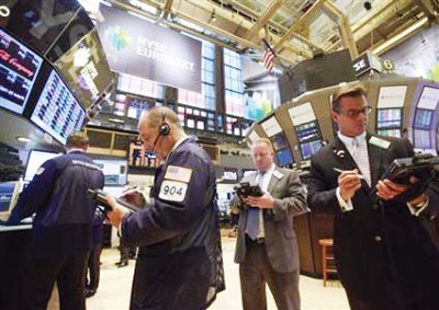 Traders work on the floor of the New York Stock Exchange. Reuters photo.