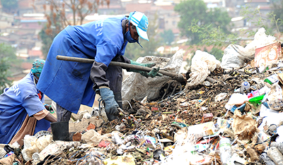 People collecting garbage. The NewTimes / File. 