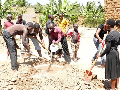 Youth involved in building for the widows. The New Times/S. Rwembeho.