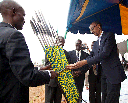 President Paul Kagame receives a gift of spears from Gicumbi residents yesterday. The New Times / T. Kisambira.