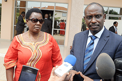 EAC Secretary General Dr Richard Sezibera (R) and Kenya's Assistant Minister for Home Affairs Beatrice Kones address journalists yesterday. The New Times / John Mbanda.