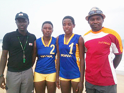 (L-R) Referee Jean de Dieu Mukundiyukuri,  Charlotte Nzayisenga, Denise Mutatsimpundu and coach Christian Hatumimana in Togo during the African Championship. The New Times/File.